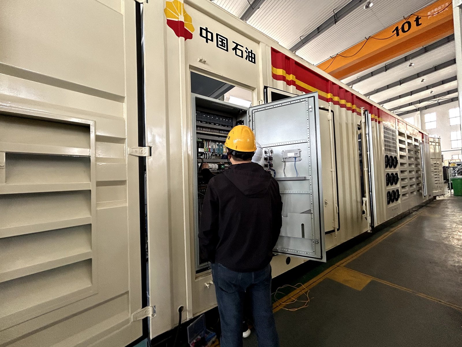 Technician commissioning an integrated compressor drive and control system